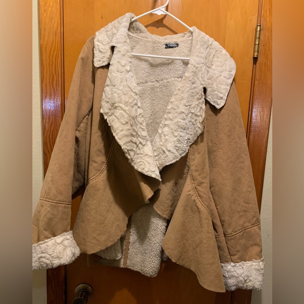 This is a Venus tan faux suede jacket with a faux fur waterfall collar